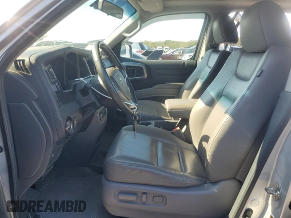2012 Honda Ridgeline RTL with VIN 5FPYK1F55CB452206, listed as a Copart auction lot 74694204 with 128,226 mi miles and Clean Title. Bid and sale history available at carsss.com. Image 7.