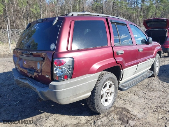 1999 Jeep Grand Cherokee Laredo with VIN 1J4GW58S5XC781472, listed as a IAAI auction lot 41738515 with 216,000 mi miles. Bid and sale history available at carsss.com. Image 4.