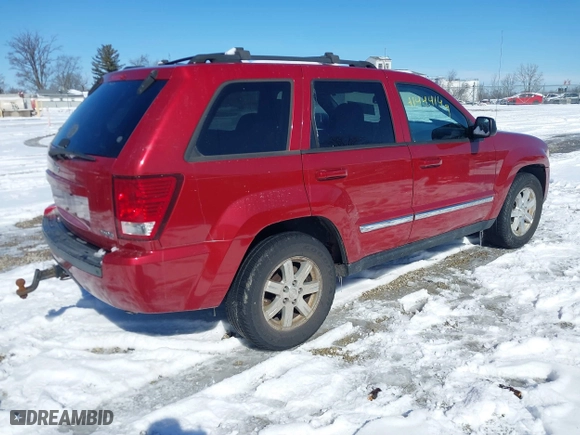 2010 Jeep Grand Cherokee Laredo with VIN 1J4RR4GT0AC135770, listed as a IAAI auction lot 41444149 with 226,746 mi miles. Bid and sale history available at carsss.com. Image 4.