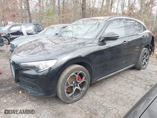 2023 Alfa Romeo Stelvio Ti with VIN ZASPAKBN6P7D56722, listed as a IAAI auction lot 41363962 with 50,073 mi miles. Bid and sale history available at carsss.com. Image 2.