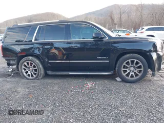 2016 GMC Yukon Denali with VIN 1GKS2CKJ2GR412201, listed as a IAAI auction lot 41185716 with 124,421 mi miles. Bid and sale history available at carsss.com. Image 13.