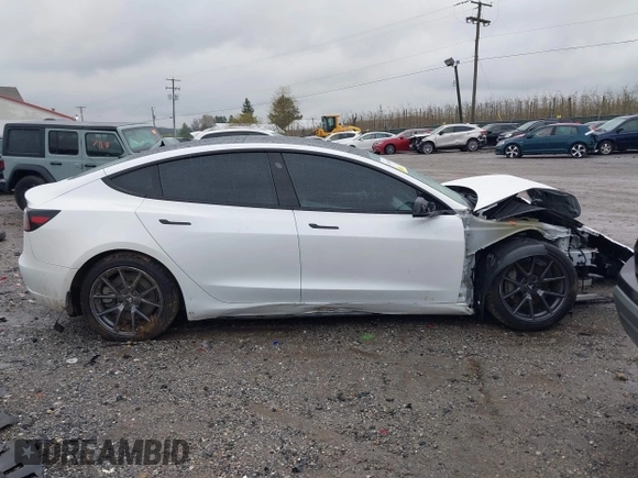 2022 Tesla Model 3 Long Range with VIN 5YJ3E1EB0NF129945, listed as a IAAI auction lot 41965531 with 59,162 mi miles and . Bid and sale history available at DreamBid. Image 13.