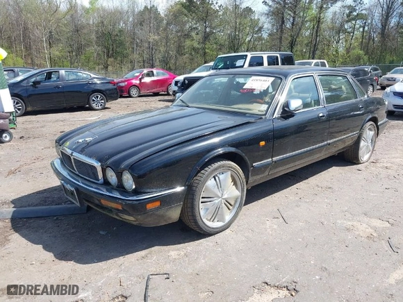 1996 Jaguar XJ Series Sedan Vanden Plas with VIN SAJKX6245TC780444, listed as a IAAI auction lot 41856403 with 1 mi miles. Bid and sale history available at carsss.com. Image 2.