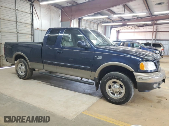 2002 Ford F-150 XL with VIN 1FTRX18L62NA69837, listed as a Copart auction lot 61581935 with 130,078 mi miles and Salvage title. Bid and sale history available at DreamBid. Image 4.