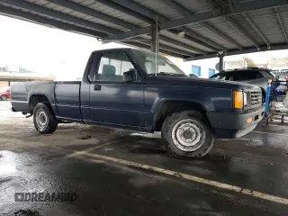 1988 Mitsubishi Mighty Max z VIN JA7FL29E9JP027859, wystawiony jako Copart lot #48638175 z przebiegiem 136 441 mil mil oraz Czysty tytuł • Clean title. Historia ofert i sprzedaży dostępna na DreamBid. Obrazek 4.
