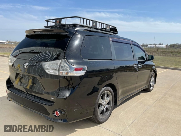 2014 Toyota Sienna SE with VIN 5TDXK3DC3ES441544, listed as a Copart auction lot 50452775 with 230,704 mi miles and Clean Title. Bid and sale history available at DreamBid. Image 4.