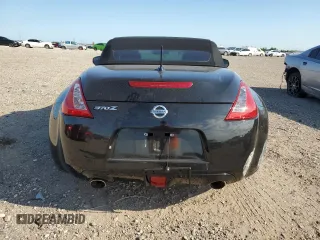 2014 Nissan 370Z Touring with VIN JN1AZ4FH3EM621279, listed as a Copart auction lot 52284814 with 60,479 mi miles and Salvage Title. Bid and sale history available at DreamBid. Image 6.