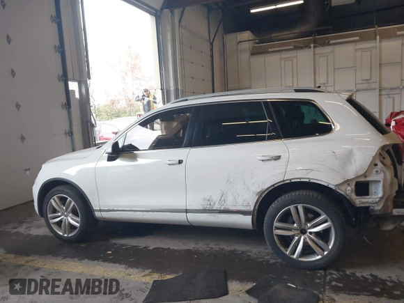 2013 Volkswagen Touareg Lux with VIN WVGEF9BP6DD007323, listed as a IAAI auction lot 41488959 with 123,383 mi miles and . Bid and sale history available at DreamBid. Image 15.