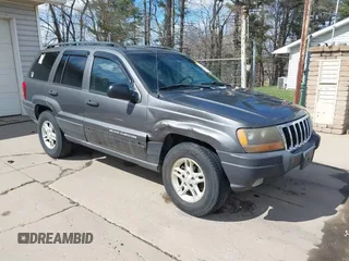 2003 Jeep Grand Cherokee Laredo with VIN 1J4GX48S53C504225, listed as a IAAI auction lot 41879669 with 247,246 mi miles. Bid and sale history available at carsss.com. Image 1.