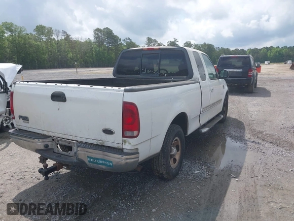 2003 Ford F-150 XL with VIN 1FTRX17L93NB61902, listed as a IAAI auction lot 42096982 with 318,850 mi miles. Bid and sale history available at carsss.com. Image 4.