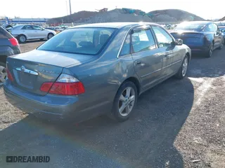 2003 Toyota Avalon XL with VIN 4T1BF28BX3U277269, listed as a IAAI auction lot 41589582 with 129,895 mi miles. Bid and sale history available at carsss.com. Image 4.