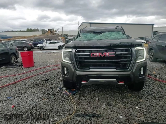 2021 GMC Yukon AT4 with VIN 1GKS2CKD8MR299277, listed as a Copart auction lot 47027565 with 54,806 mi miles and Salvage Title. Bid and sale history available at carsss.com. Image 14.
