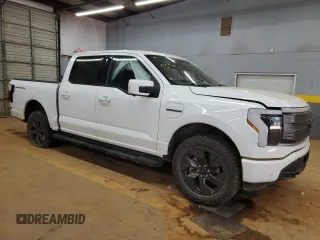 2023 Ford F-150 Lightning Pro with VIN 1FTVW1EL1PWG05889, listed as a Copart auction lot 48022435 with 20,904 mi miles and Salvage Title. Bid and sale history available at DreamBid. Image 4.