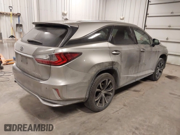 2018 Lexus RX 350L Premium z VIN JTJDZKCA6J2004385, wystawiony jako IAAI lot #41382429 z przebiegiem 111 638 mil mil oraz . Historia ofert i sprzedaży dostępna na DreamBid. Obrazek 4.