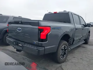 2023 Ford F-150 Lightning Pro with VIN 1FTVW1EL8PWG48559, listed as a IAAI auction lot 42033123 with 8,845 mi miles and . Bid and sale history available at DreamBid. Image 4.