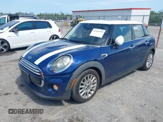 2015 MINI Hardtop 4 Door with VIN WMWXS5C51FT827510, listed as a IAAI auction lot 42365599 with 53,667 mi miles and . Bid and sale history available at DreamBid. Image 2.
