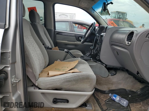 2005 GMC Envoy SLT with VIN 1GKDT13S152124404, listed as a Copart auction lot 64011494 with 212,951 mi miles and Salvage Title. Bid and sale history available at DreamBid. Image 7.
