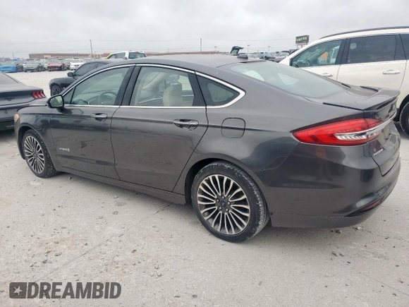 2017 Ford Fusion Hybrid Titanium with VIN 3FA6P0RU7HR388521, listed as a Copart auction lot 57318895 with 117,720 mi miles and Salvage title. Bid and sale history available at DreamBid. Image 2.