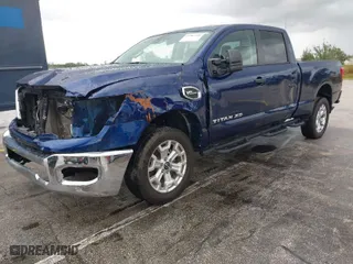 2023 Nissan Titan XD PRO-4X with VIN 1N6AA1FB9PN106795, listed as a IAAI auction lot 41987240 with 38,107 mi miles. Bid and sale history available at carsss.com. Image 2.