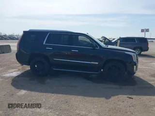2015 Cadillac Escalade Luxury z VIN 1GYS4BKJ6FR291441, wystawiony jako IAAI lot #41881022 z przebiegiem 128 659 mil mil oraz . Historia ofert i sprzedaży dostępna na DreamBid. Obrazek 13.