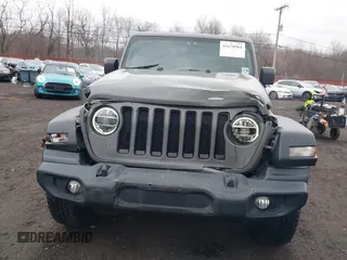 2021 Jeep Wrangler Unlimited Sport S with VIN 1C4HJXDG5MW614688, listed as a IAAI auction lot 41678964 with 89,309 mi miles. Bid and sale history available at carsss.com. Image 12.