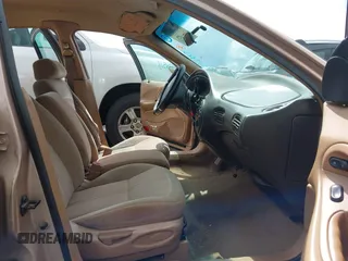 1997 Ford Taurus GL z VIN 1FALP52U9VA280563, wystawiony jako IAAI lot #42045413 z przebiegiem 219 484 mil mil oraz . Historia ofert i sprzedaży dostępna na DreamBid. Obrazek 5.