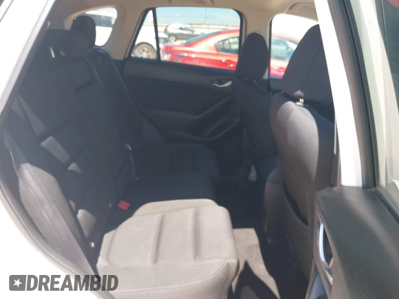 2016 Mazda CX-5 Touring z VIN JM3KE2CY0G0840918, wystawiony jako IAAI lot #42205529 z przebiegiem 74 515 mil mil oraz . Historia ofert i sprzedaży dostępna na DreamBid. Obrazek 8.