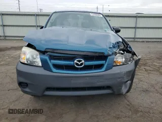 2005 Mazda Tribute i with VIN 4F2YZ02ZX5KM17738, listed as a Copart auction lot 72346384 with 203,245 mi miles and Salvage Title. Bid and sale history available at carsss.com. Image 5.