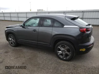 2022 Mazda MX-30 Premium Plus Package with VIN JM1DRADB4N0100893, listed as a Copart auction lot 46955985 with 25,705 mi miles and Salvage Title. Bid and sale history available at carsss.com. Image 2.