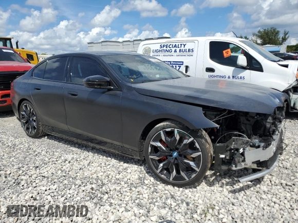 2024 BMW i5 M60 with VIN WBY43FK00RCR71826, listed as a Copart auction lot 72140144 with 5,987 mi miles and Salvage Title. Bid and sale history available at carsss.com. Image 4.