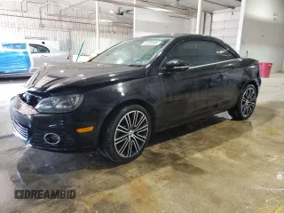 2014 Volkswagen Eos Komfort with VIN WVWBW8AH8EV000316, listed as a Copart auction lot 52208485 with 124,338 mi miles and Salvage Title. Bid and sale history available at DreamBid. Image 1.