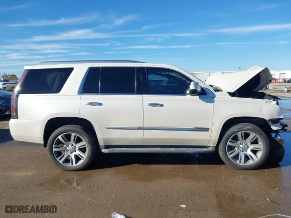 2015 Cadillac Escalade Luxury with VIN 1GYS3MKJXFR651714, listed as a IAAI auction lot 41205449 with 129,066 mi miles. Bid and sale history available at carsss.com. Image 14.
