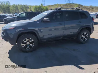 2014 Jeep Cherokee Trailhawk z VIN 1C4PJMBS6EW213931, wystawiony jako Copart lot #56567385 z przebiegiem 156 576 mil mil oraz Szkoda całkowita • Salvage title. Historia ofert i sprzedaży dostępna na DreamBid. Obrazek 1.