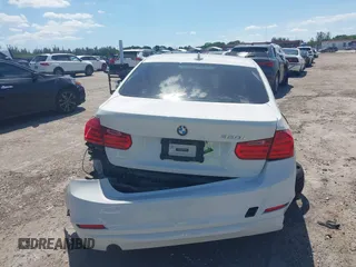 2014 BMW 3 Series 320i with VIN WBA3B1C51EK131063, listed as a IAAI auction lot 42043086 with 92,306 mi miles. Bid and sale history available at carsss.com. Image 16.