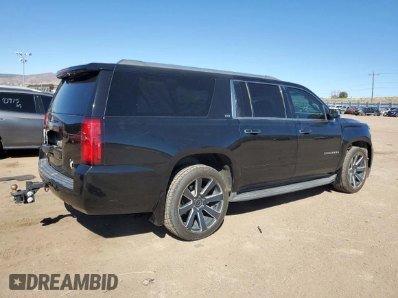 2015 Chevrolet Suburban LTZ with VIN 1GNSKKKC2FR634654, listed as a Copart auction lot 50337415 with 150,255 mi miles and Salvage Title. Bid and sale history available at DreamBid. Image 3.