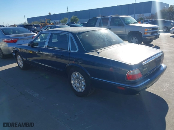 2000 Jaguar XJ with VIN SAJDA14C4YLF16529, listed as a IAAI auction lot 41387819 with 90,143 mi miles. Bid and sale history available at carsss.com. Image 3.