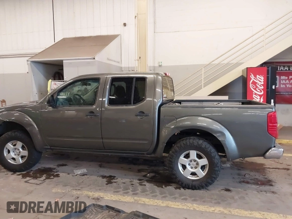 2005 Nissan Frontier 4WD LE with VIN 1N6AD07W95C411421, listed as a IAAI auction lot 41847242 with 209,816 mi miles. Bid and sale history available at carsss.com. Image 14.