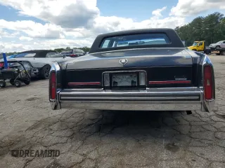 1988 Cadillac Brougham z VIN 1G6DW51Y1J9731375, wystawiony jako Copart lot #55673625 z przebiegiem 91 741 mil mil oraz Szkody całkowita. Historia ofert i sprzedaży dostępna na DreamBid. Obrazek 6.