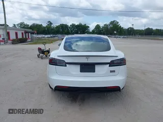 2022 Tesla Model S Plaid with VIN 5YJSA1E6XNF473888, listed as a IAAI auction lot 42141141 with 28,584 mi miles and . Bid and sale history available at carsss.com. Image 16.