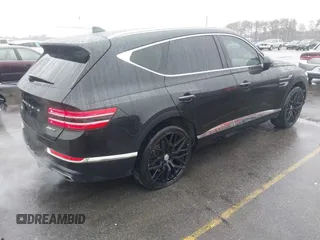2022 Genesis GV80 with VIN KMUHCESC0NU083778, listed as a IAAI auction lot 41553215 with 93,384 mi miles and . Bid and sale history available at DreamBid. Image 4.