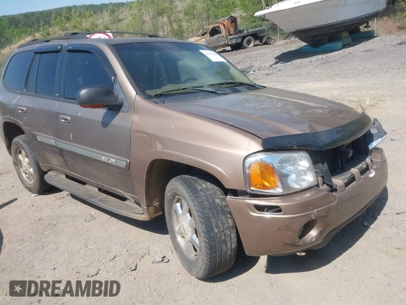 2003 GMC Envoy SLT with VIN 1GKDS13S832208655, listed as a IAAI auction lot 42076668 with 160,787 mi miles. Bid and sale history available at carsss.com. Image 1.