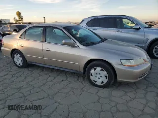 2001 Honda Accord LX z VIN 1HGCG16461A067174, wystawiony jako Copart lot #87543245 z przebiegiem 148 410 mil mil oraz Czysty tytuł • Clean title. Historia ofert i sprzedaży dostępna na DreamBid. Obrazek 4.
