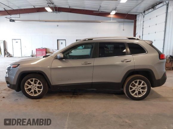 2014 Jeep Cherokee Latitude with VIN 1C4PJLCS1EW106004, listed as a IAAI auction lot 41786457 with 145,588 mi miles. Bid and sale history available at carsss.com. Image 14.