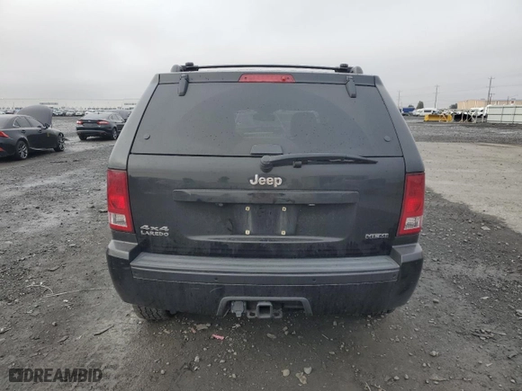 2010 Jeep Grand Cherokee Laredo with VIN 1J4RR4GT7AC120604, listed as a Copart auction lot 84257724 with 60,827 mi miles and Salvage Title. Bid and sale history available at carsss.com. Image 6.