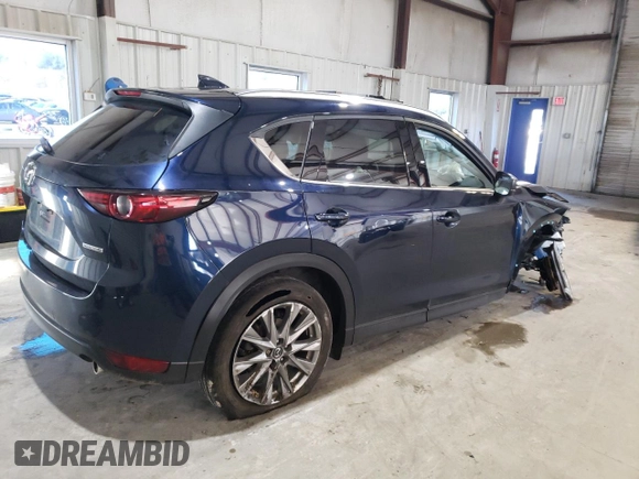 2021 Mazda CX-5 Grand Touring with VIN JM3KFBDM3M0327635, listed as a Copart auction lot 49980635 with 47,160 mi miles and Salvage Title. Bid and sale history available at carsss.com. Image 3.