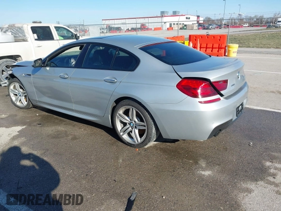 2015 BMW 6 Series 640i xDrive with VIN WBA6B8C52FD453433, listed as a IAAI auction lot 41805317 with 138,685 mi miles and . Bid and sale history available at carsss.com. Image 3.