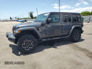 2023 Jeep Wrangler Rubicon z VIN 1C4JJXR65PW557849, wystawiony jako Copart lot #57845705 z przebiegiem 21 849 mil mil oraz Szkoda całkowita • Salvage title. Historia ofert i sprzedaży dostępna na DreamBid. Obrazek 1.