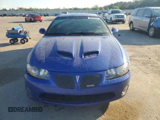 2006 Pontiac GTO z VIN 6G2VX12U66L516949, wystawiony jako Copart lot #55618225 z przebiegiem 77 371 mil mil oraz Tytuł czysty. Historia ofert i sprzedaży dostępna na DreamBid. Obrazek 5.