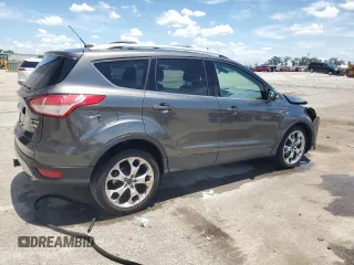 2015 Ford Escape Titanium z VIN 1FMCU0J98FUB06577, wystawiony jako Copart lot #61341175 z przebiegiem 66 206 mil mil oraz Szkoda całkowita • Salvage title. Historia ofert i sprzedaży dostępna na DreamBid. Obrazek 3.