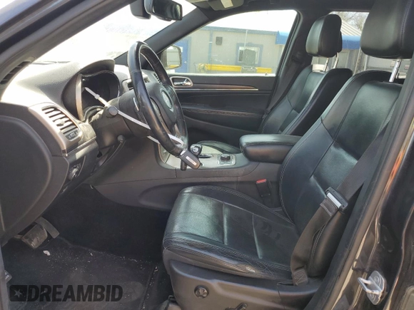 2014 Jeep Grand Cherokee Limited with VIN 1C4RJFBG4EC265947, listed as a Copart auction lot 52448155 with 127,700 mi miles and Salvage title. Bid and sale history available at DreamBid. Image 7.